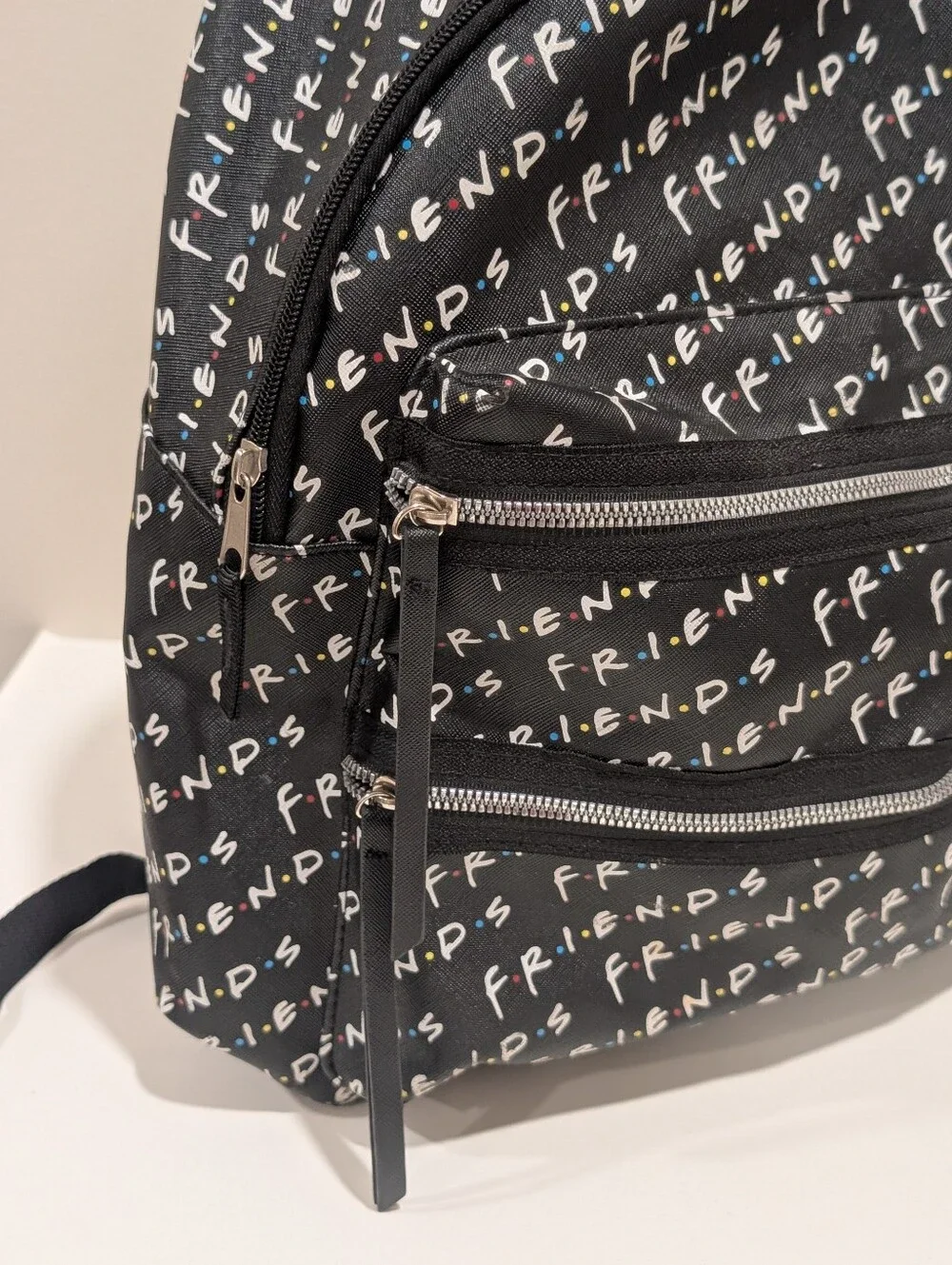 Friends Backpack all over print. need small repair see zoomed in photo